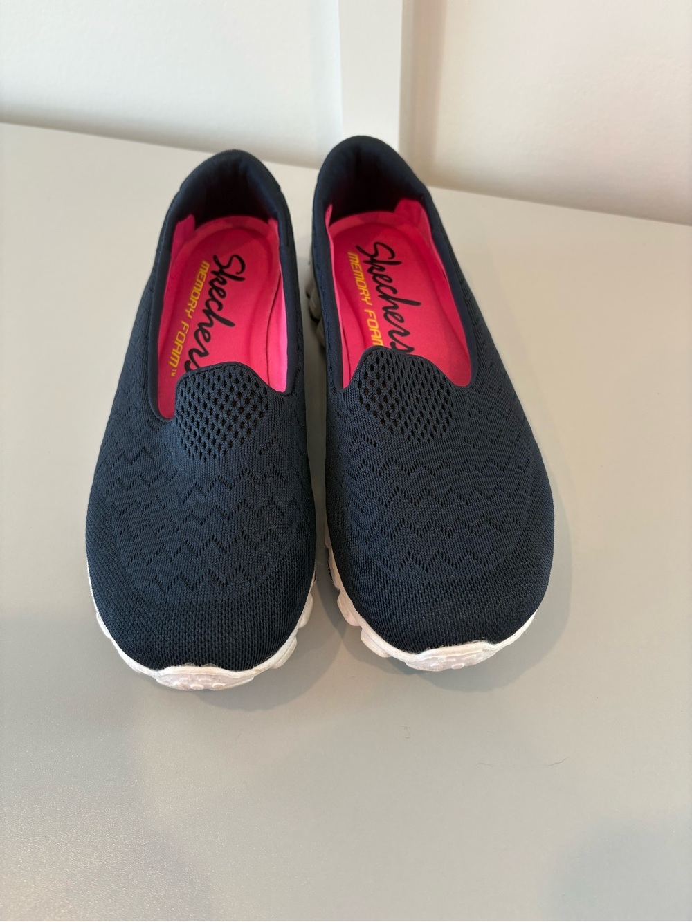 Skechers Women's Navy Slip-On Athletic Shoes with Pink Insole